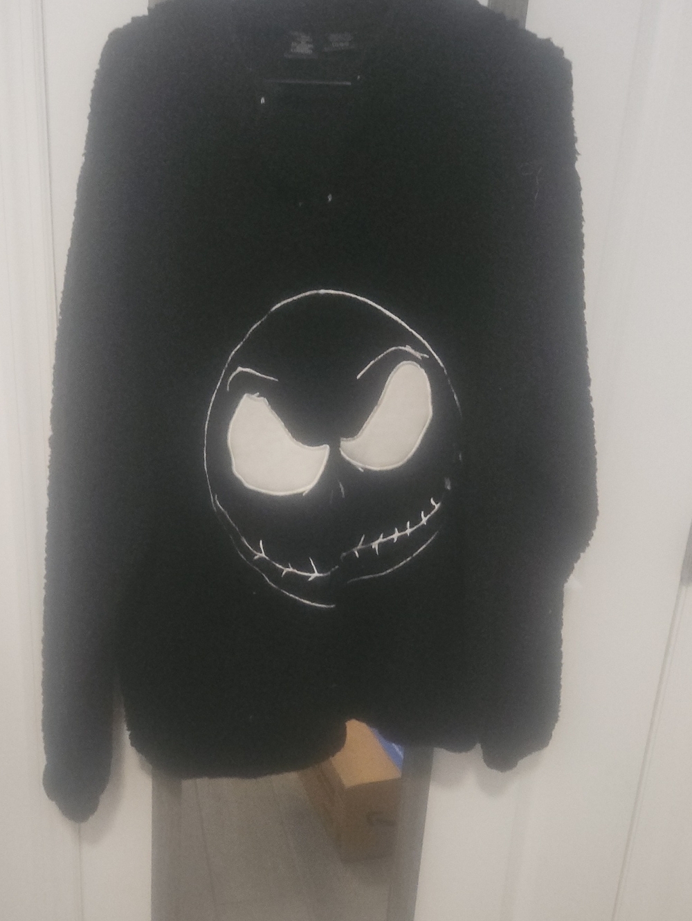 Black Fuzzy Jacket with Embroidered Smiling Skull Face
